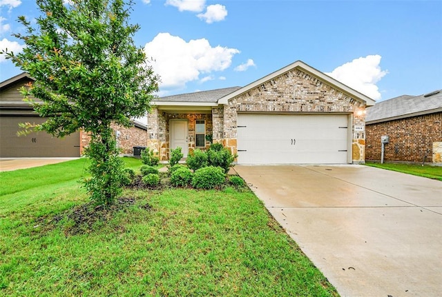 ranch-style home featuring brick siding, driveway, an attached garage, and a front yard