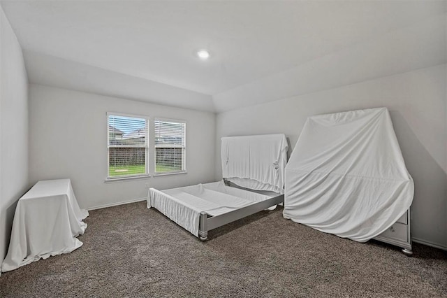 bedroom with baseboards and carpet floors