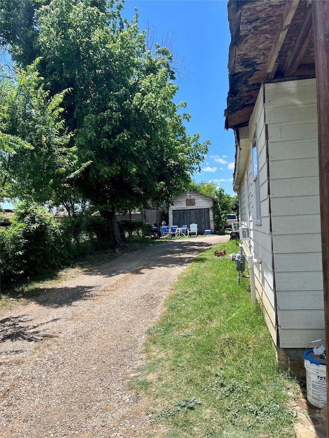 exterior space featuring driveway and an outdoor structure