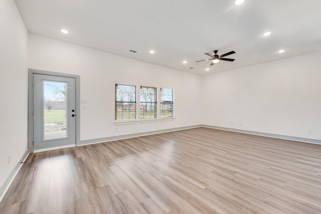 spare room featuring visible vents, baseboards, ceiling fan, recessed lighting, and light wood-style flooring