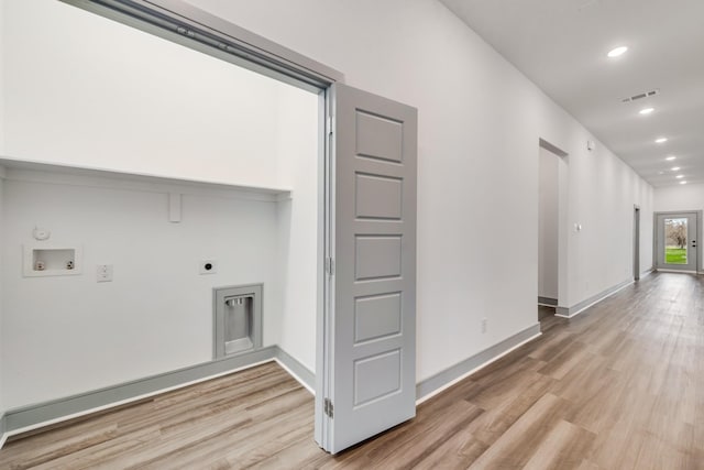 laundry room with visible vents, laundry area, hookup for a washing machine, light wood-style flooring, and hookup for an electric dryer