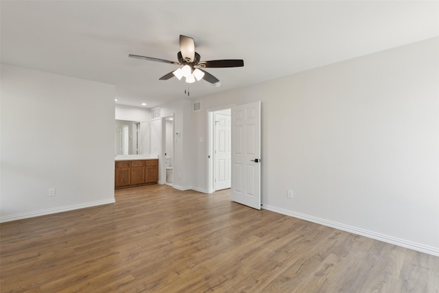 interior space featuring visible vents, baseboards, and light wood-style floors