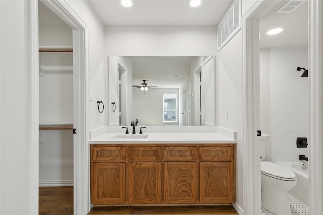 full bathroom with visible vents, recessed lighting, toilet, and vanity