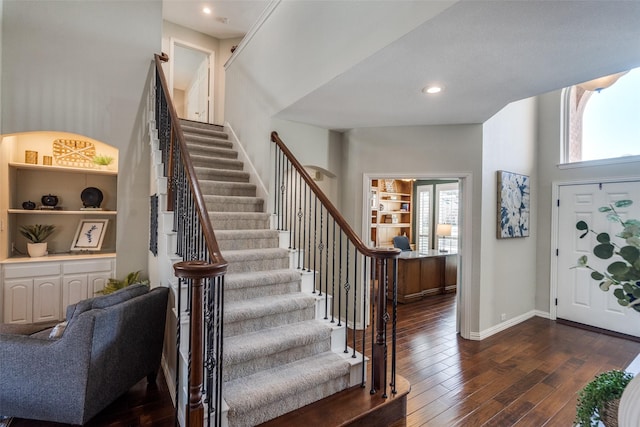 entryway featuring stairway, recessed lighting, dark wood-type flooring, and baseboards