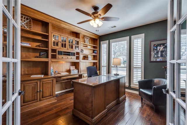 office space with a ceiling fan, visible vents, baseboards, dark wood-style flooring, and french doors