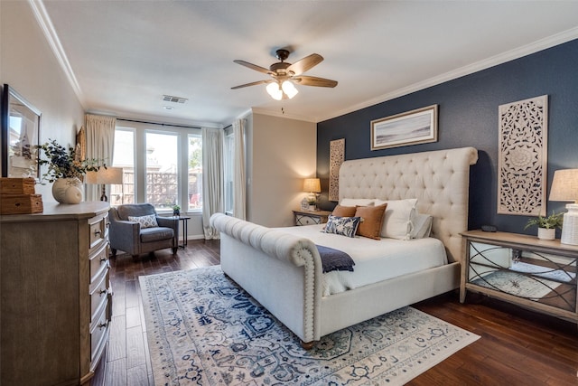 bedroom with visible vents, dark wood-type flooring, and ornamental molding