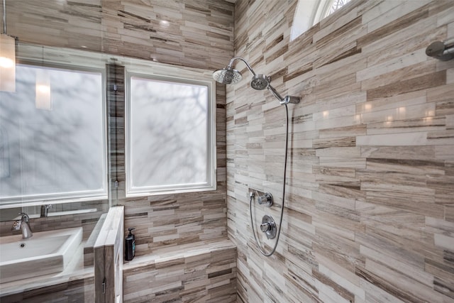 full bath featuring a tile shower