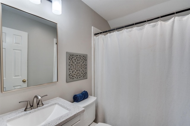 full bathroom featuring toilet and vanity