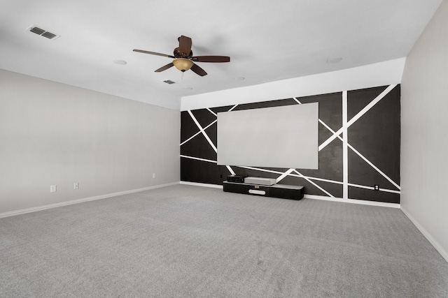 spare room with visible vents, baseboards, a ceiling fan, and carpet flooring