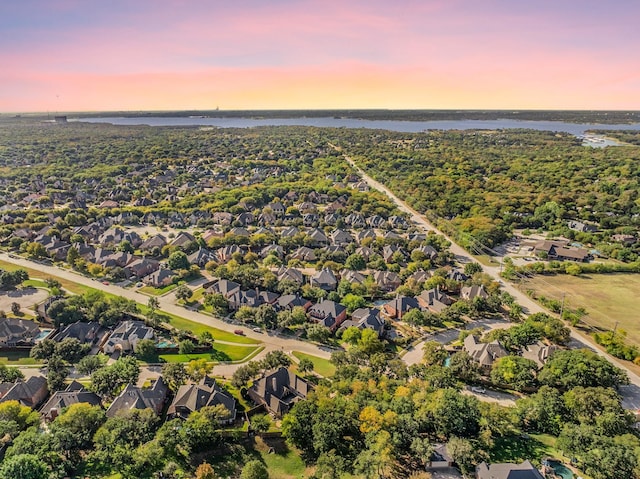 drone / aerial view with a residential view and a water view