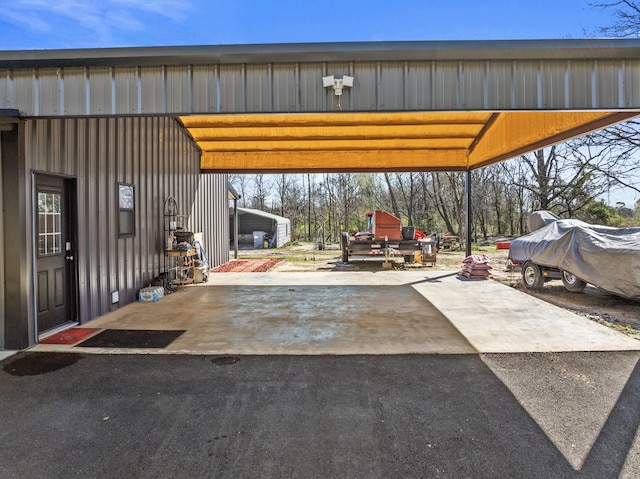 view of patio / terrace featuring aphalt driveway