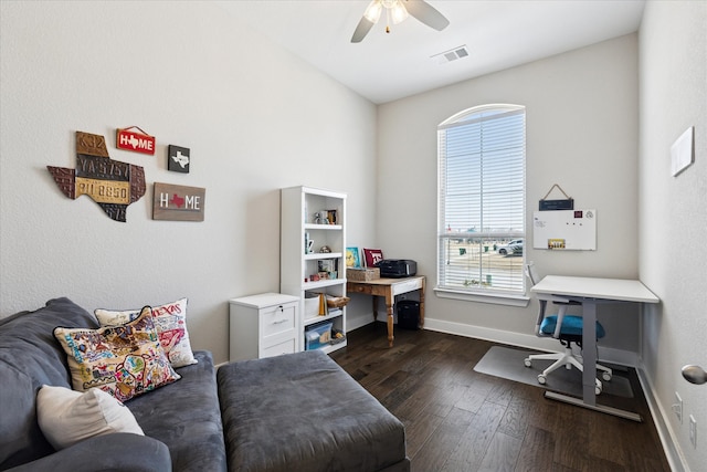 office space with a ceiling fan, dark wood-style floors, visible vents, and baseboards