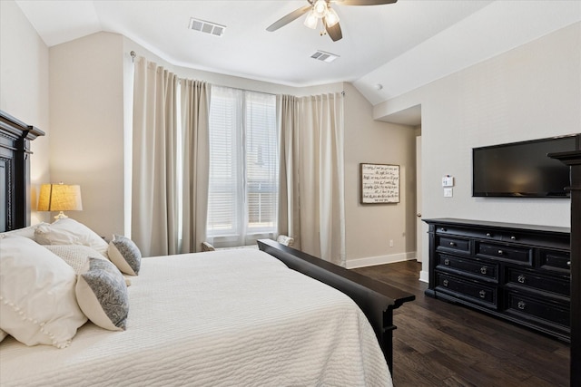 bedroom featuring visible vents, baseboards, dark wood-style flooring, and vaulted ceiling