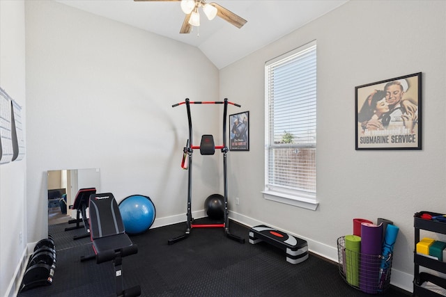 workout area with vaulted ceiling, a ceiling fan, and baseboards