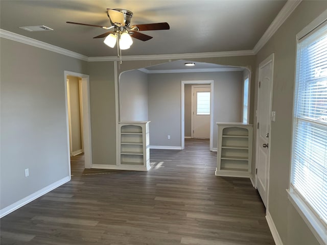 unfurnished room featuring visible vents, ceiling fan, baseboards, ornamental molding, and dark wood-style floors