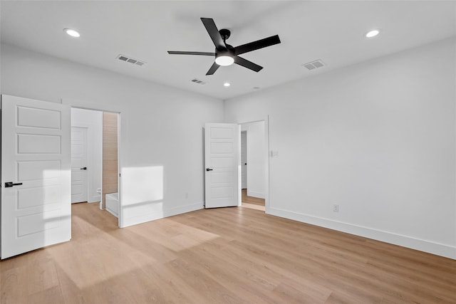 unfurnished bedroom featuring visible vents, baseboards, and light wood-style flooring