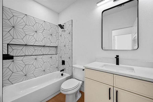 bathroom featuring visible vents, shower / washtub combination, toilet, and vanity