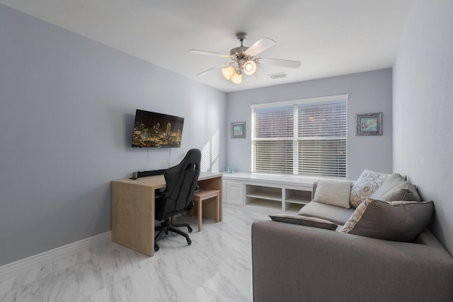 home office featuring visible vents, marble finish floor, baseboards, and a ceiling fan