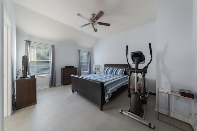 bedroom with a ceiling fan, baseboards, and vaulted ceiling