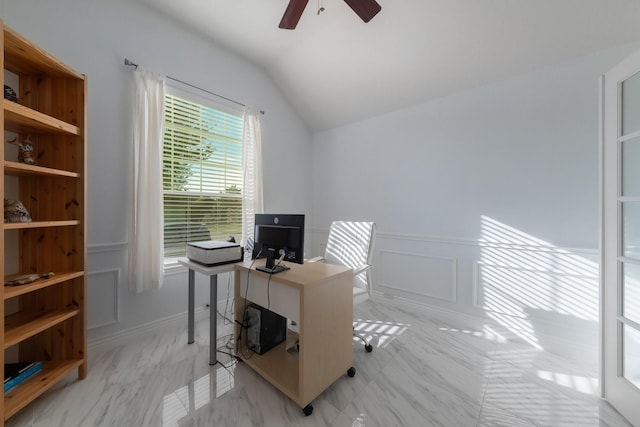 office space with ceiling fan, wainscoting, and lofted ceiling