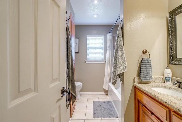 bathroom featuring vanity, shower / tub combo, a textured ceiling, tile patterned floors, and toilet