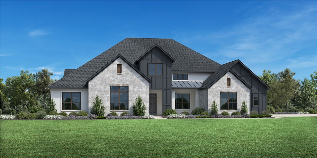 modern farmhouse with metal roof, a front lawn, a standing seam roof, and roof with shingles