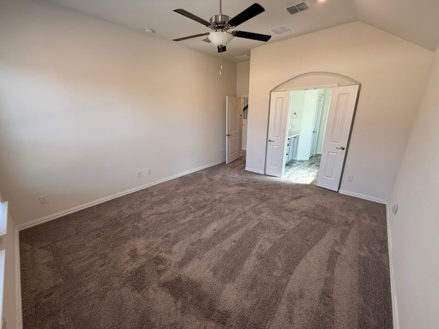 unfurnished bedroom with vaulted ceiling, visible vents, baseboards, and carpet floors