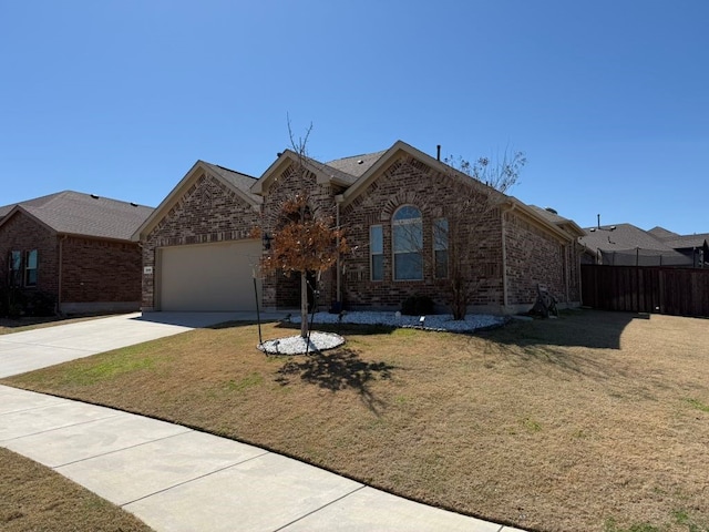 ranch-style house with brick siding, an attached garage, fence, a front yard, and driveway