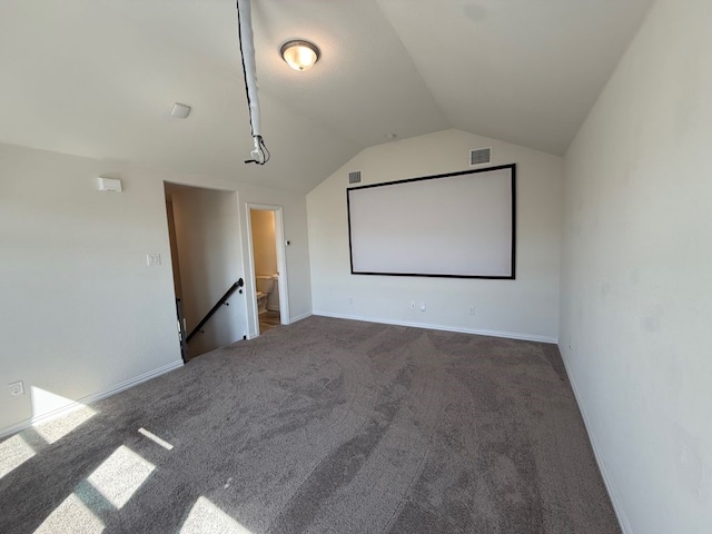 cinema with visible vents, baseboards, lofted ceiling, and carpet floors