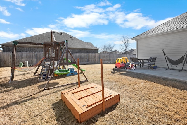 view of play area featuring a patio area and a fenced backyard