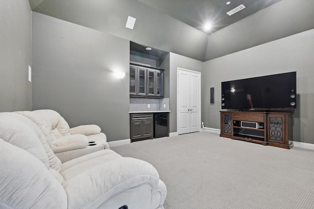 carpeted living area featuring baseboards, visible vents, wet bar, lofted ceiling, and recessed lighting