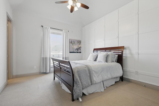 bedroom with light colored carpet, baseboards, and ceiling fan