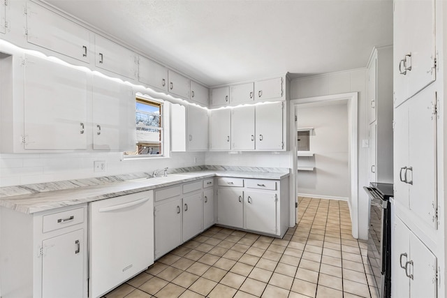 kitchen featuring backsplash, dishwasher, white cabinets, and light countertops