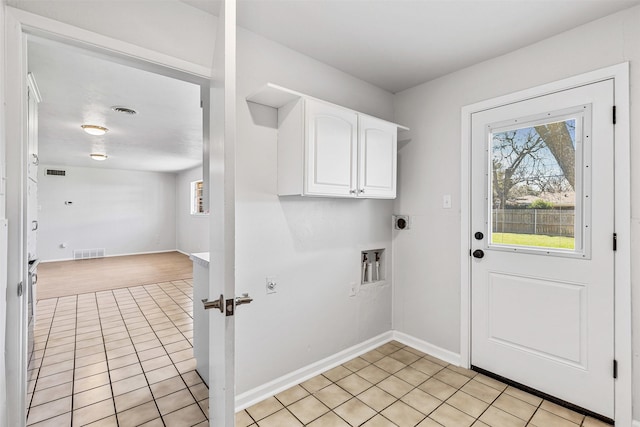 laundry room featuring light tile patterned floors, visible vents, cabinet space, and hookup for an electric dryer