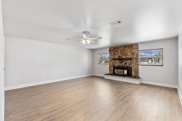 unfurnished living room with visible vents, baseboards, light wood-type flooring, and a ceiling fan