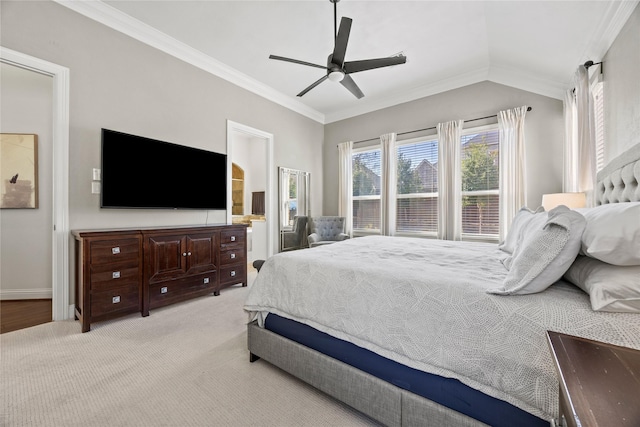 bedroom with a ceiling fan, baseboards, carpet floors, lofted ceiling, and crown molding