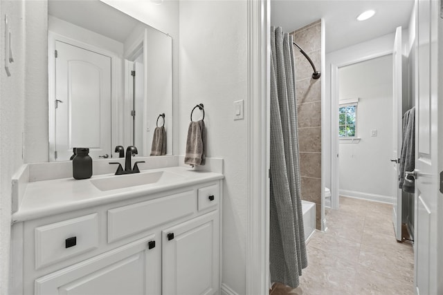 bathroom featuring tile patterned floors, recessed lighting, shower / bath combination with curtain, baseboards, and vanity