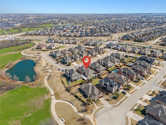 birds eye view of property featuring a residential view and a water view