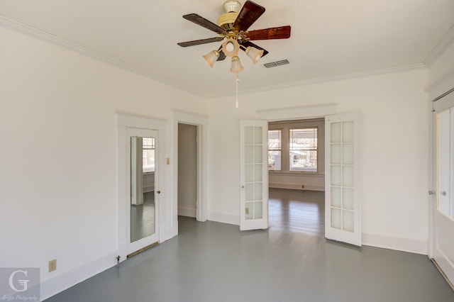 empty room with a wealth of natural light, french doors, ornamental molding, and a ceiling fan