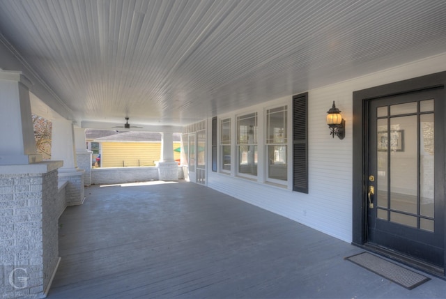 view of patio with a porch and a ceiling fan