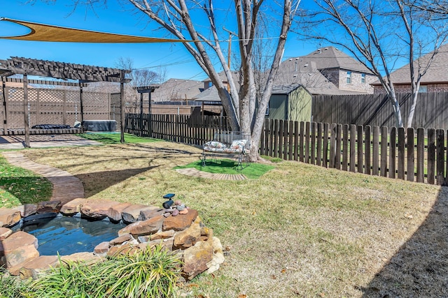 view of yard featuring a pergola and a fenced backyard