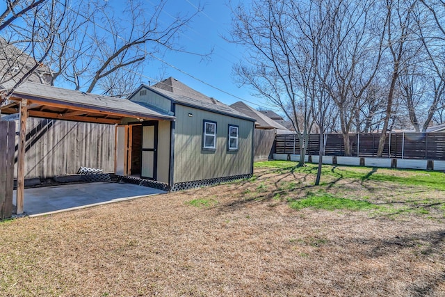 view of outbuilding featuring an outbuilding and fence