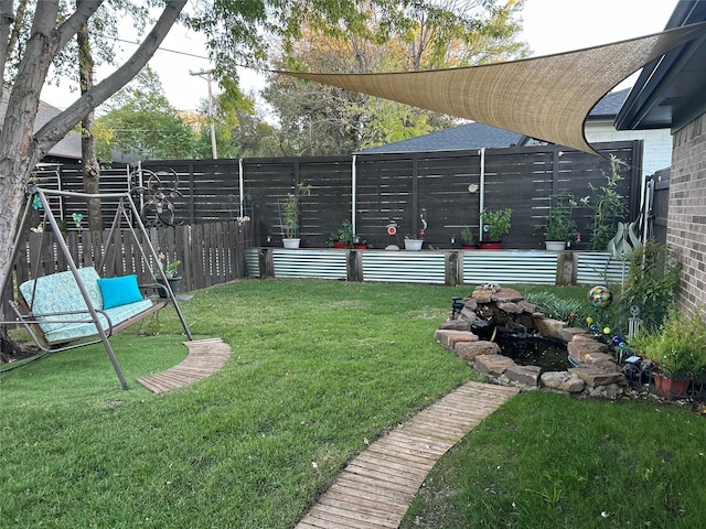 view of yard with a fenced backyard