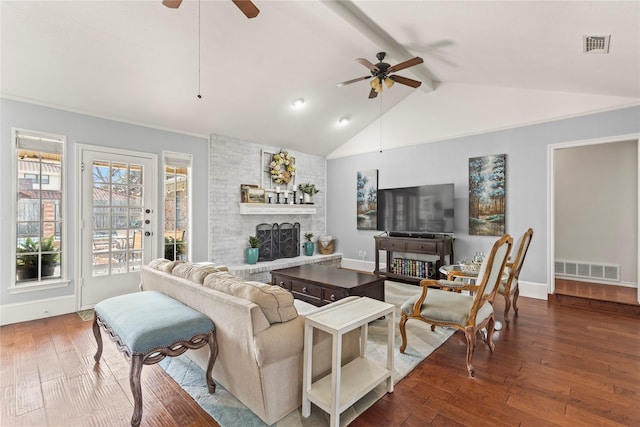 living area with visible vents, a ceiling fan, and wood-type flooring