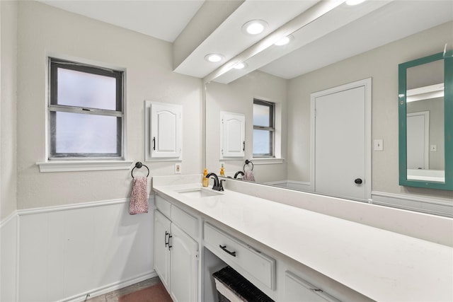 bathroom with wainscoting and vanity