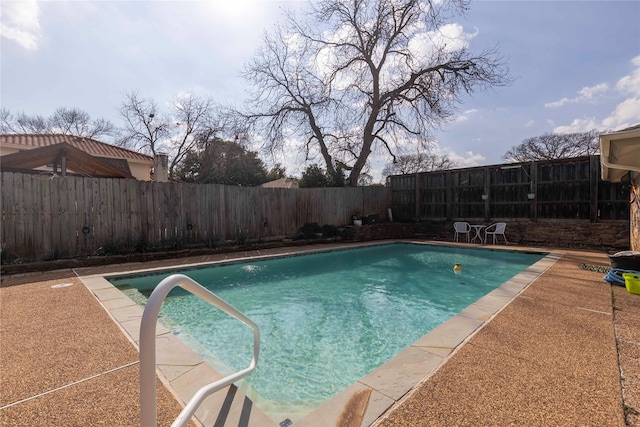 view of pool with a fenced in pool, a patio, and a fenced backyard