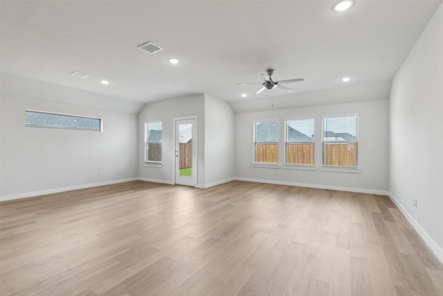 unfurnished living room with visible vents, recessed lighting, light wood-style floors, baseboards, and vaulted ceiling