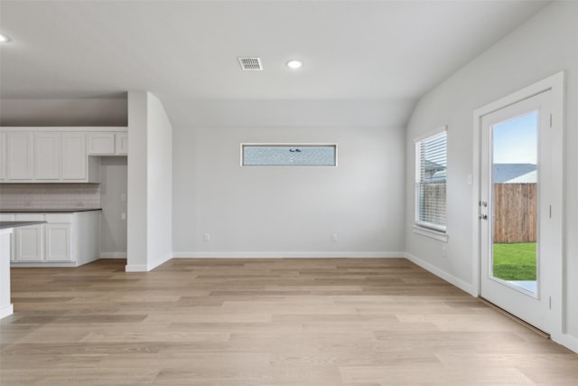 interior space featuring light wood finished floors, visible vents, recessed lighting, and baseboards