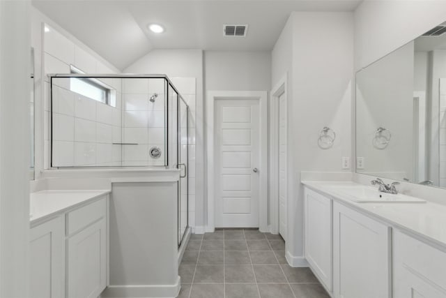 full bath featuring tile patterned floors, visible vents, a stall shower, and vanity