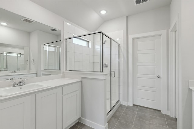 bathroom with tile patterned flooring, a shower stall, and visible vents